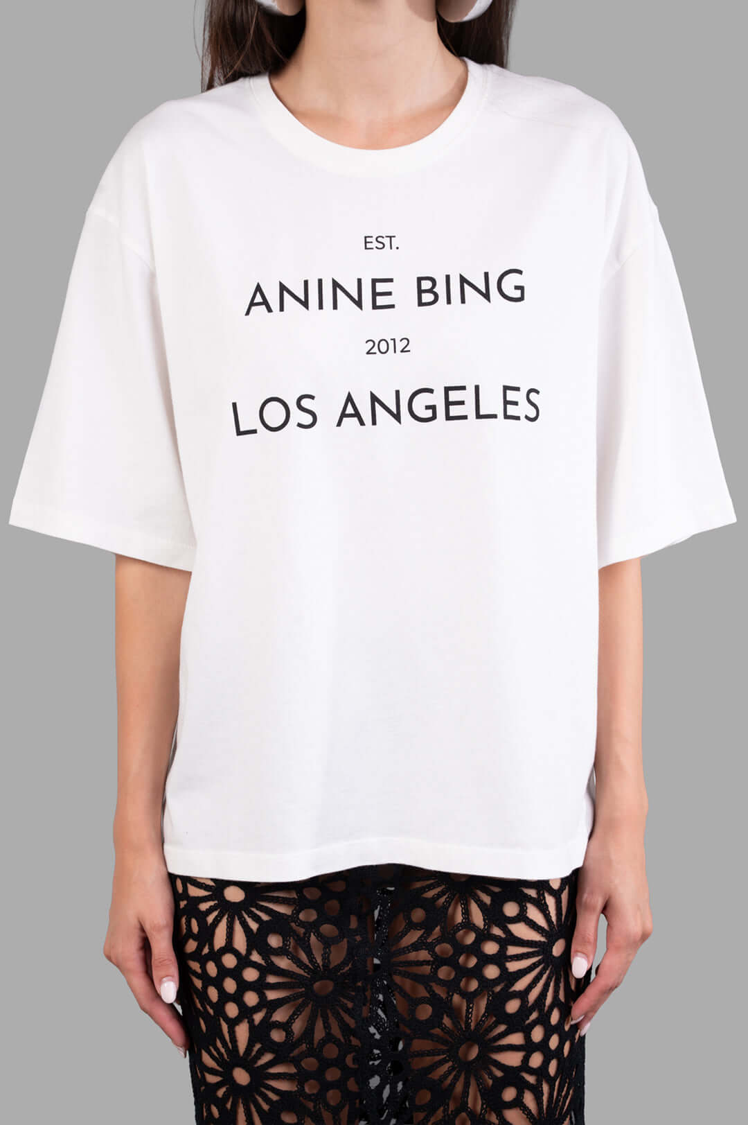 Anine Bing. Logo-print T-shirt in white, featuring a bold front logo detail and relaxed fit with dropped shoulders.