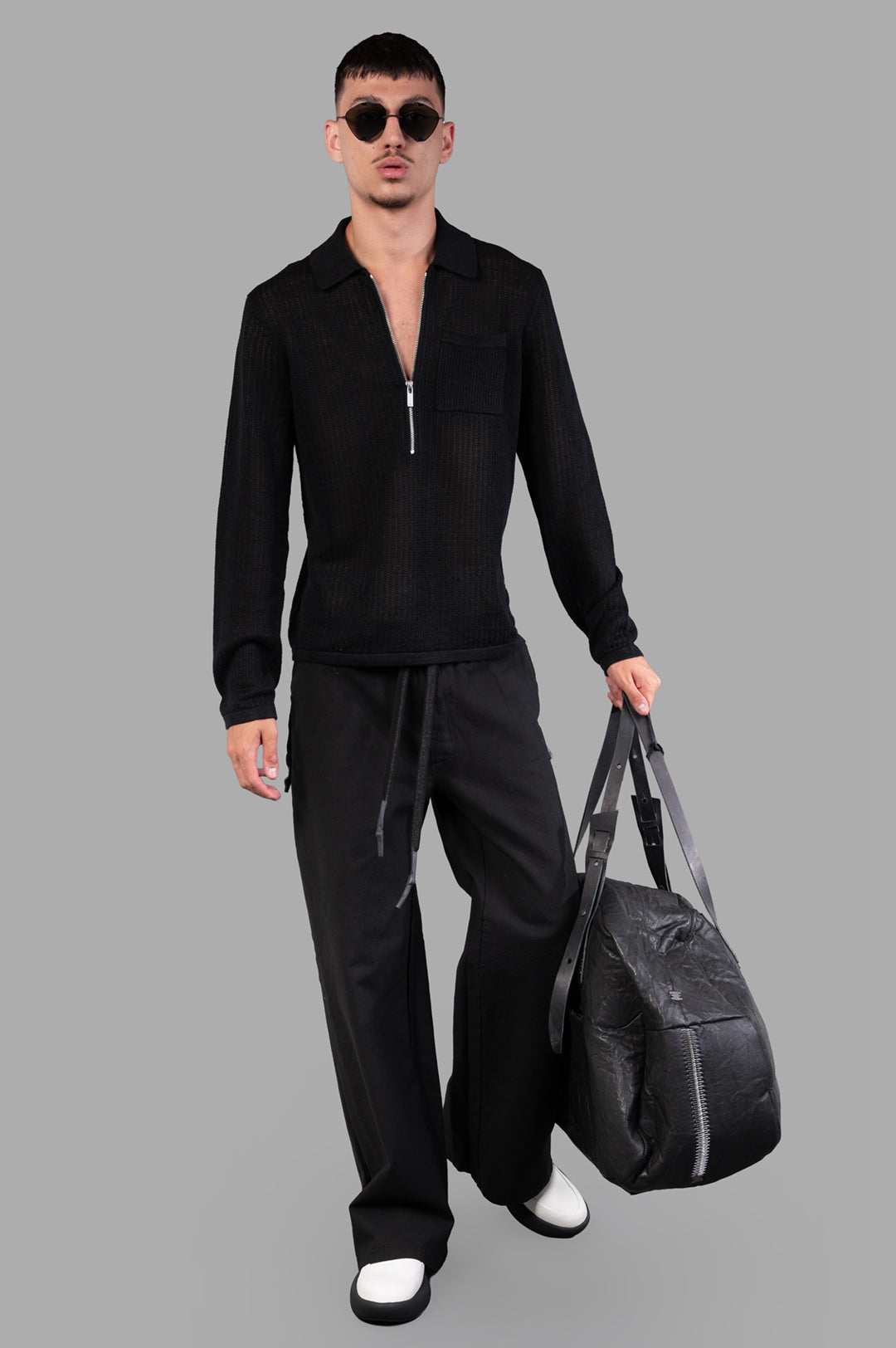 Helmut Lang Long-sleeve Zip Polo in Black, textured knit front view on model, airy linen fabric.