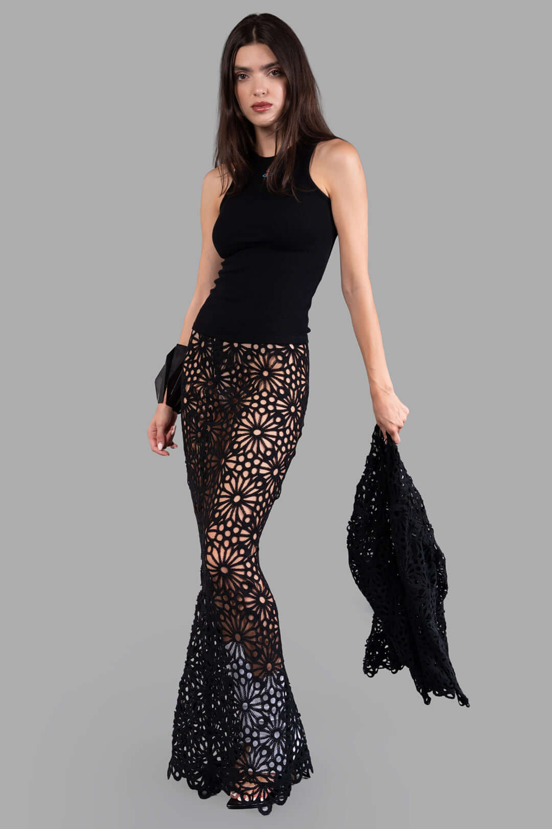 Norma Kamali Obie Long Skirt in black sheer fabric, on-model, showing elastic waist and fishtail hem elegance.