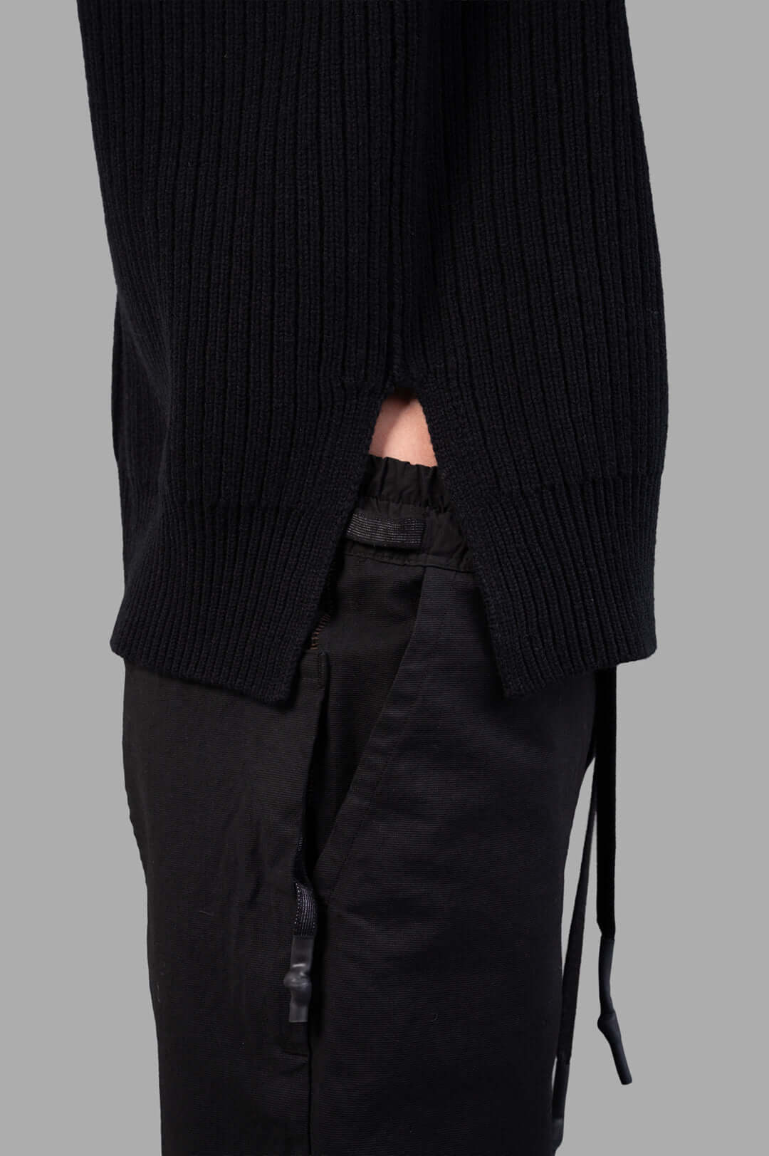Rick Owens Concordians SL Fisherman Turtle, black sleeveless knit, highlighted texture and ribbed details on side view.