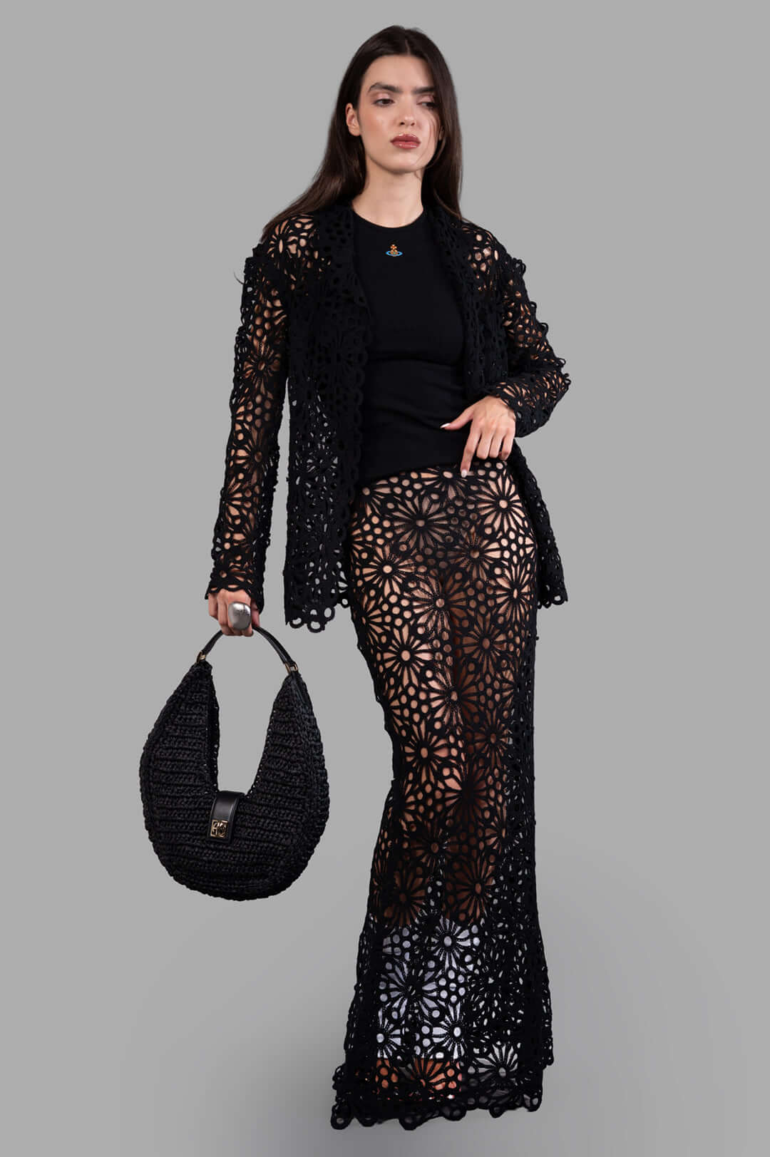 Norma Kamali black Floral-motif Jacket shown on-model with detailed floral pattern and tailored single-breasted fit.