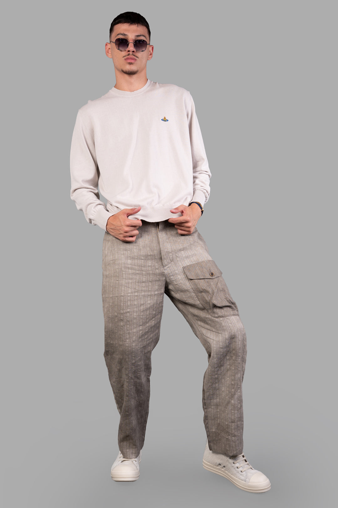 Vivienne Westwood Cream Orb-embroidered Jumper on-model, featuring chest logo and ribbed crewneck, dusty white color.