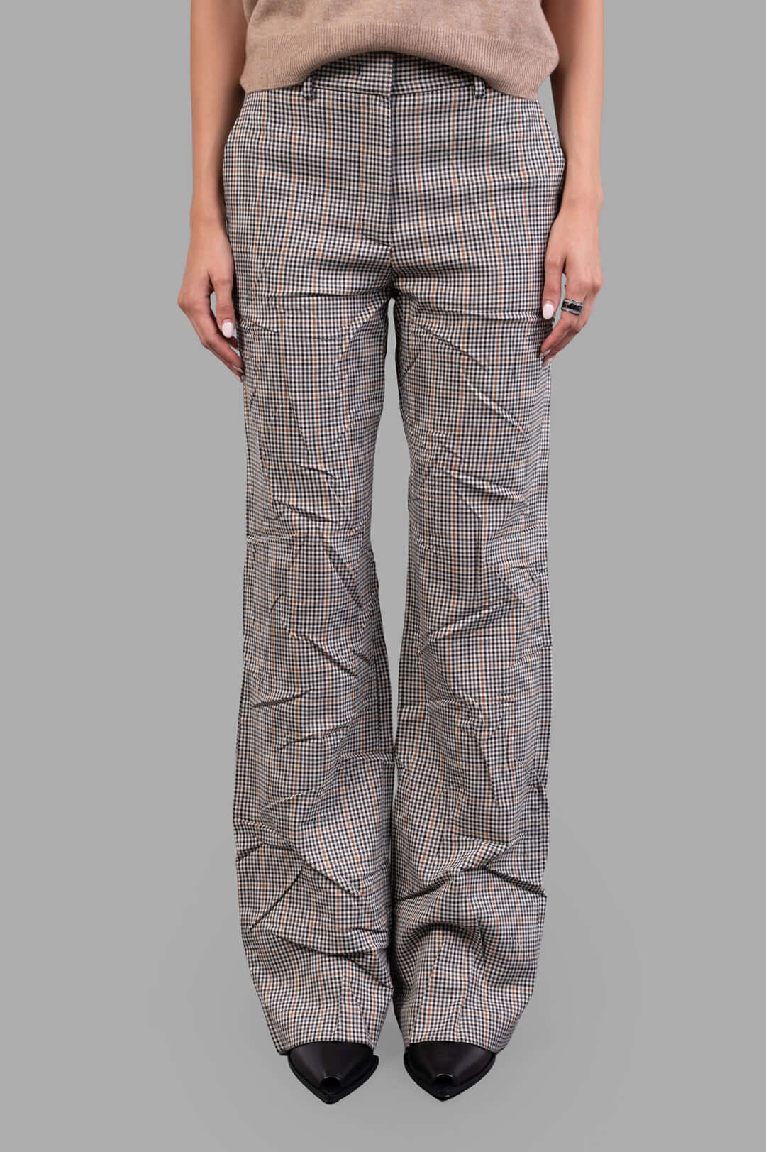 MSGM Creased Plaid Trousers displayed on-model in brown; high-waisted with a sophisticated crease effect and tailored fit.