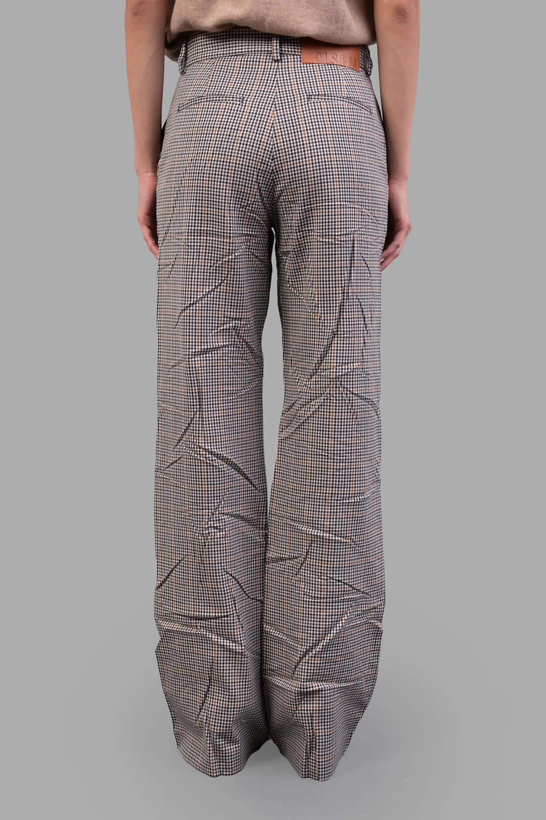 MSGM Creased Plaid Trousers, high-waisted with a crease effect, showcasing a tailored fit and sophisticated brown plaid pattern.