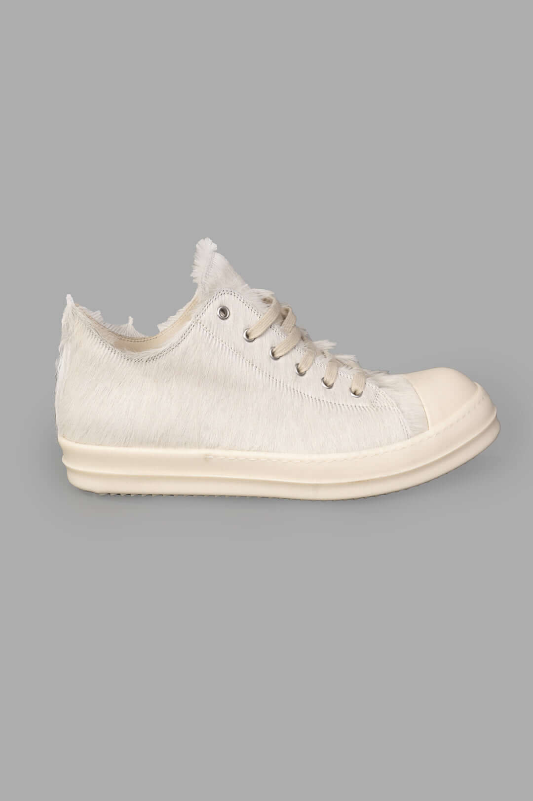 Rick Owens Leather Low Top Sneakers in Milk, side view. Features distinctive textured suede, cowhide, and laces.