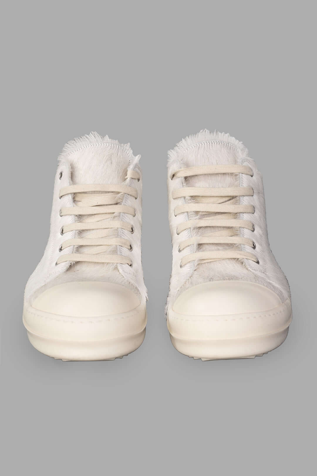 Rick Owens Leather Low Top Sneakers feature a close-up view showcasing unique velour suede and hair-on leather with laces.