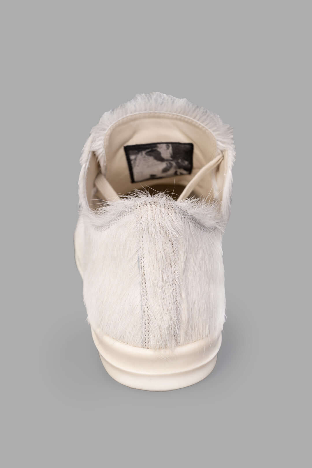 Rick Owens Leather Low Top Sneakers, detailed view of the back showcasing soft hair-on leather and robust bumper sole.