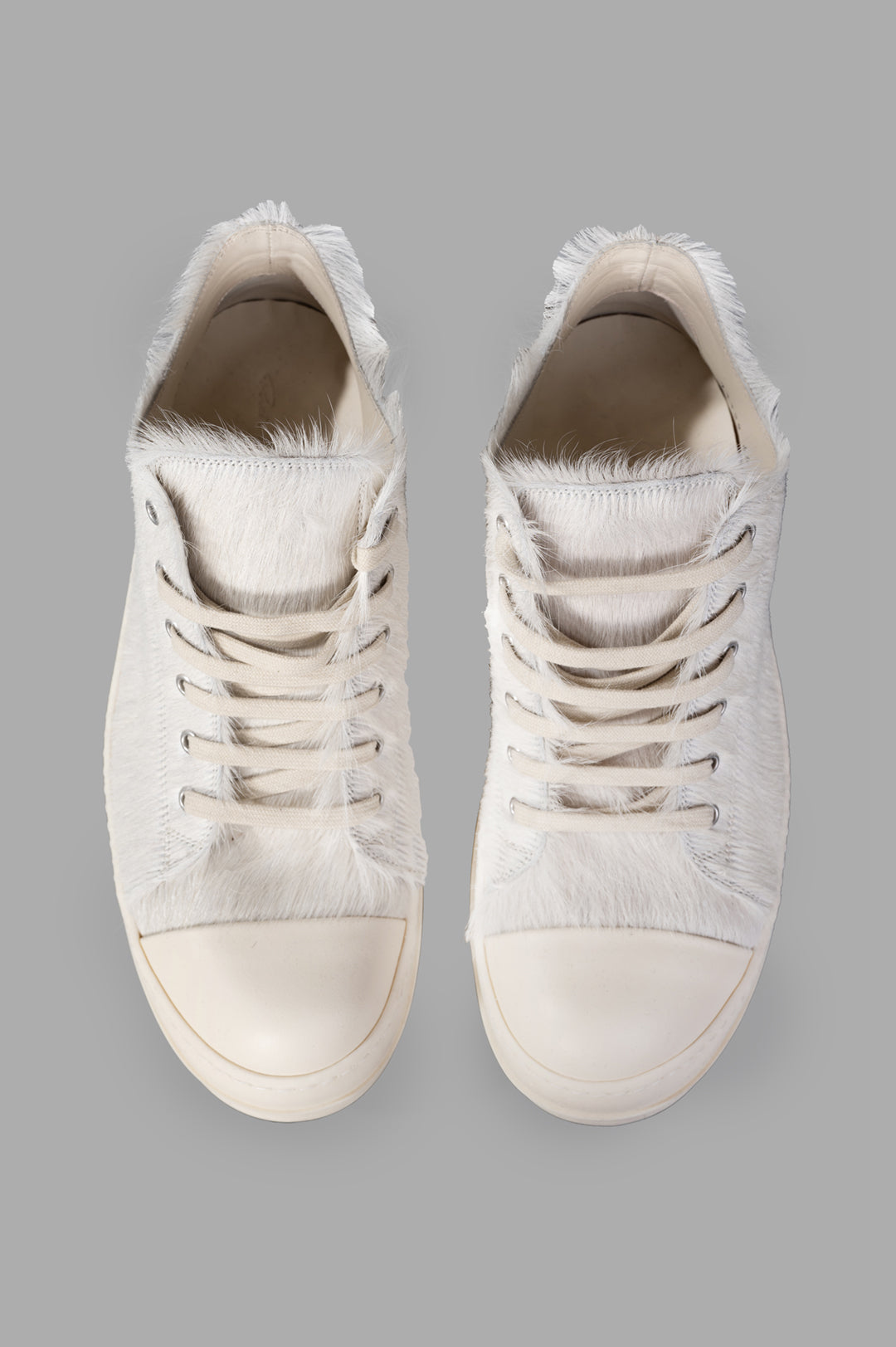 Rick Owens Leather Low Top Sneakers featuring velour suede and cowhide leather, showing detailed texture and laces from.