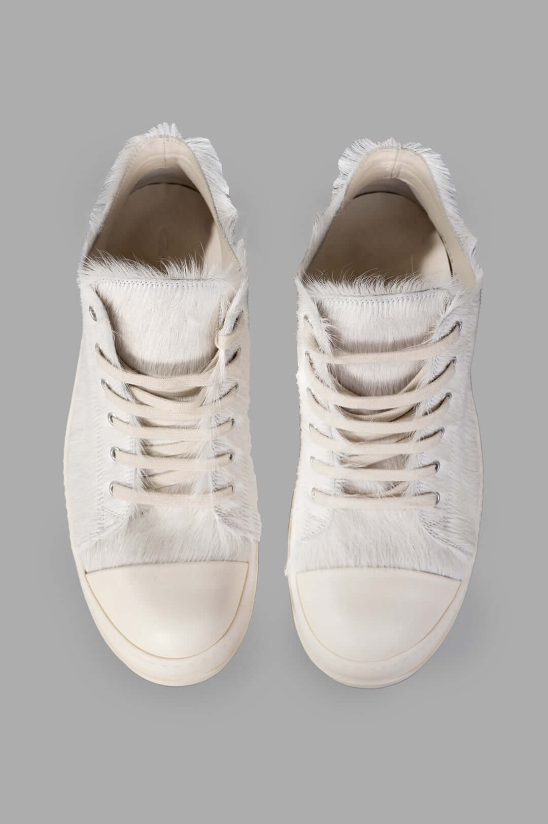 Rick Owens Leather Low Top Sneakers featuring velour suede and cowhide leather, showing detailed texture and laces from.