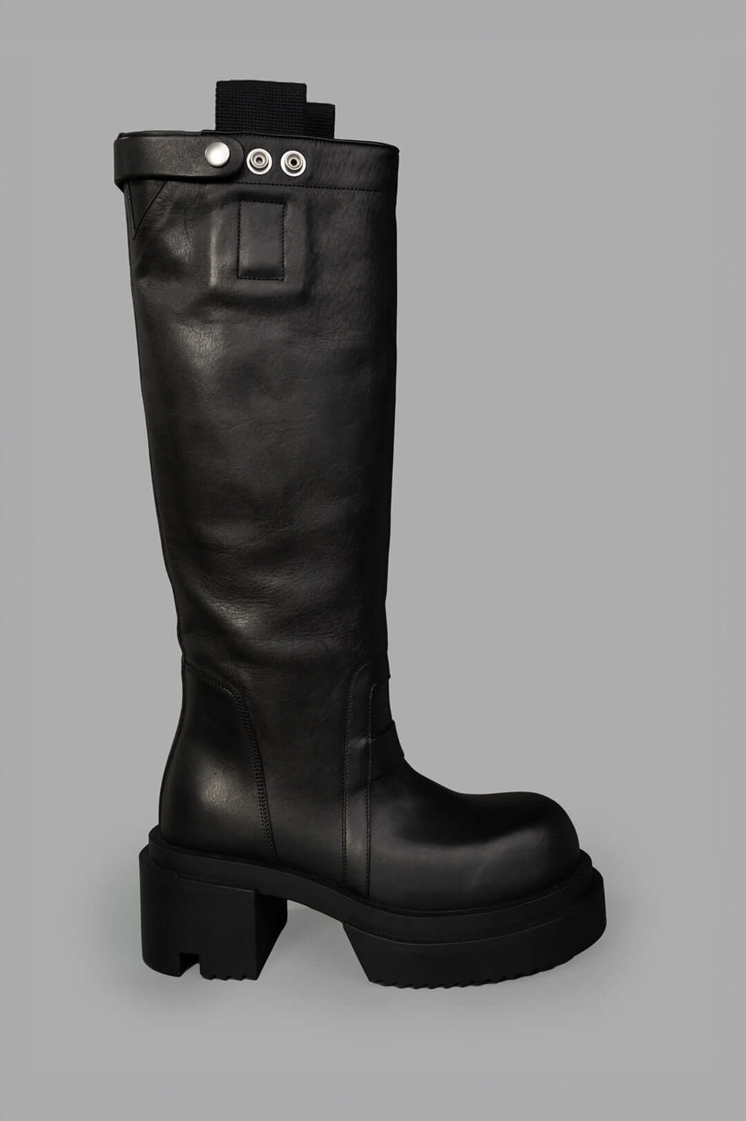 Rick Owens Bogun Knee-high Boots, side view showcasing black leather texture and chunky sole design.