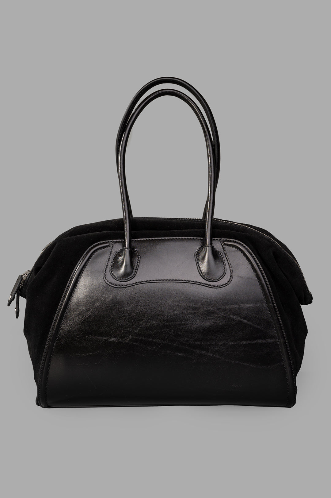 Vivienne Westwood Shirley Holdall in black leather featuring suede accents, highlighting the iconic orb emblem and side.