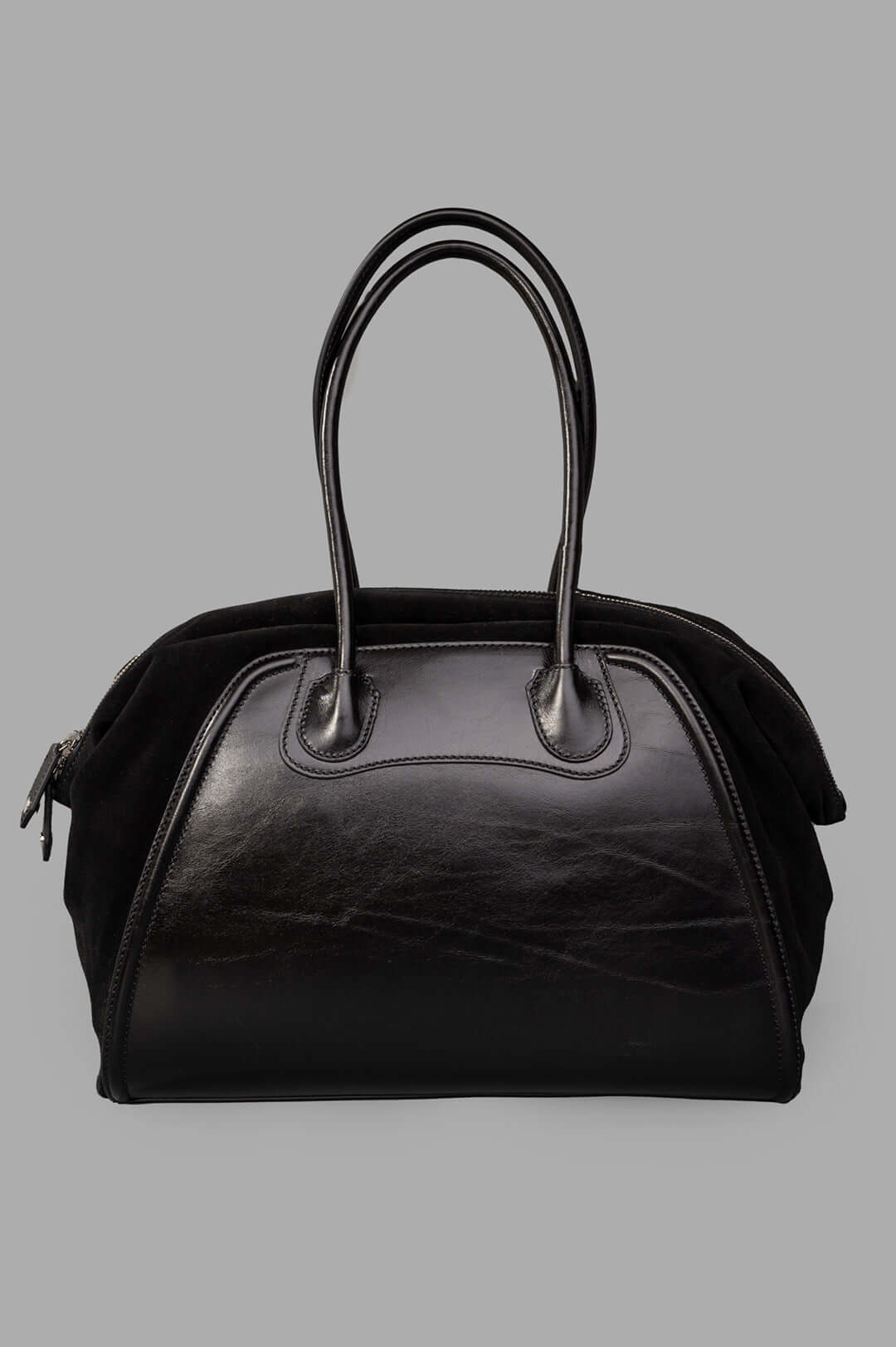 Vivienne Westwood Shirley Holdall in black leather featuring suede accents, highlighting the iconic orb emblem and side.