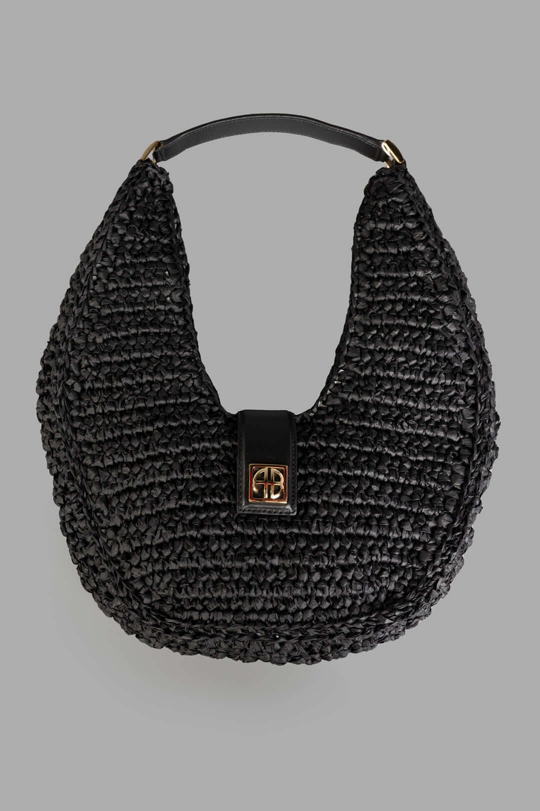 Anine Bing Raffia Monogram Shoulder Bag in Black, featuring front view of raffia texture with leather trim and gold logo.