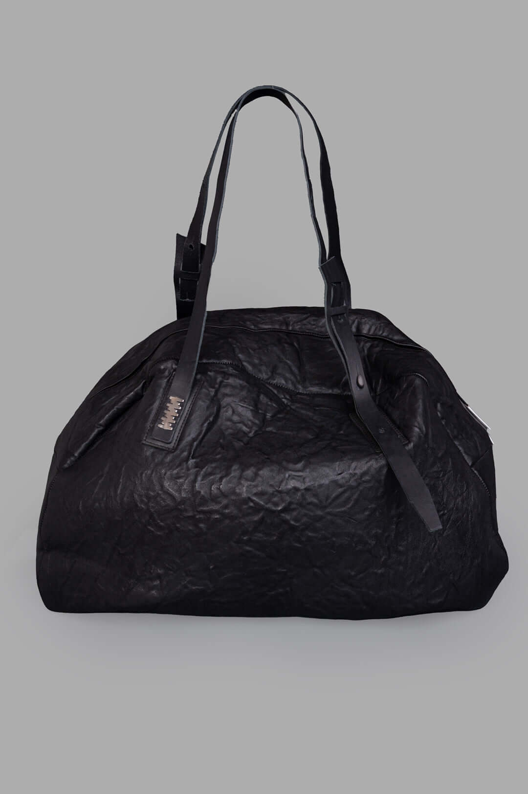 Isaac Sellam oversized leather bag, front view, crinkled texture, double handles, black, ideal for travel or gym essentials.