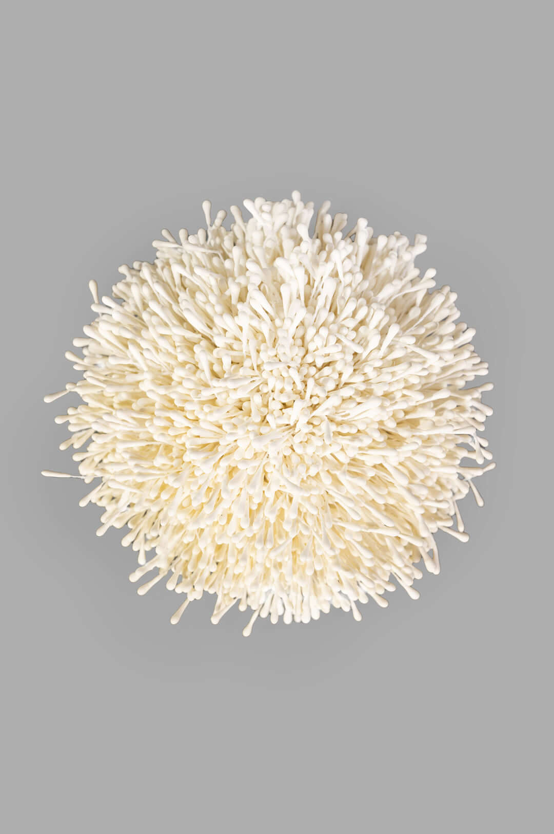 By Malene Birger white Henna Brooch, top view. Anemone-inspired design in 100% polyester, detailed texture.