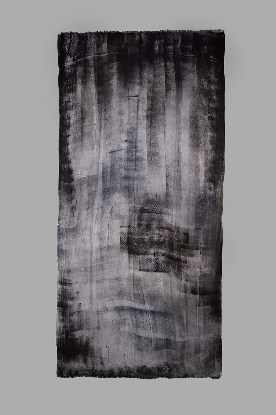 Avant Toi Graphic-print Scarf in Black showcasing bold print design, frayed edges, and soft wool texture. Perfect for versatile styling.