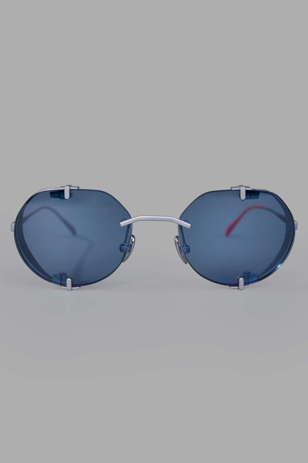 Vysen Eyewear The Uttar - UT4 rimless round titanium glasses with clear blue lenses, front view.