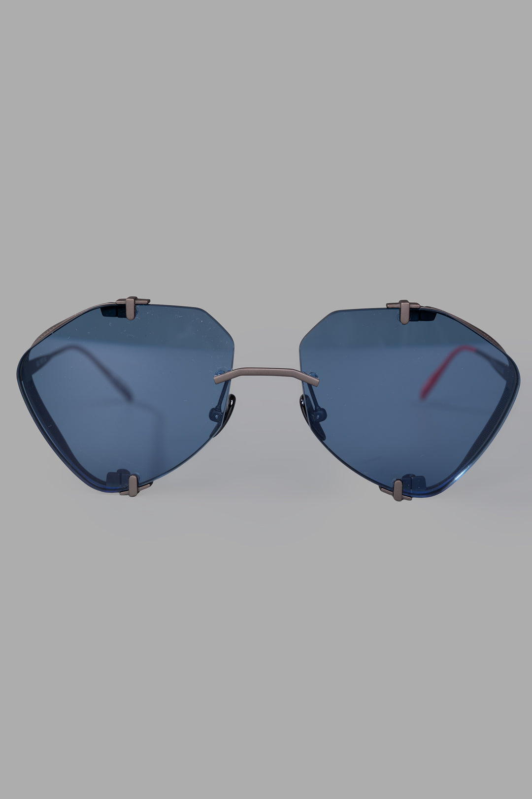 Vysen Eyewear The Khoid - KH5 rimless titanium aviator sunglasses with blue lenses, front view, showcasing modern design.