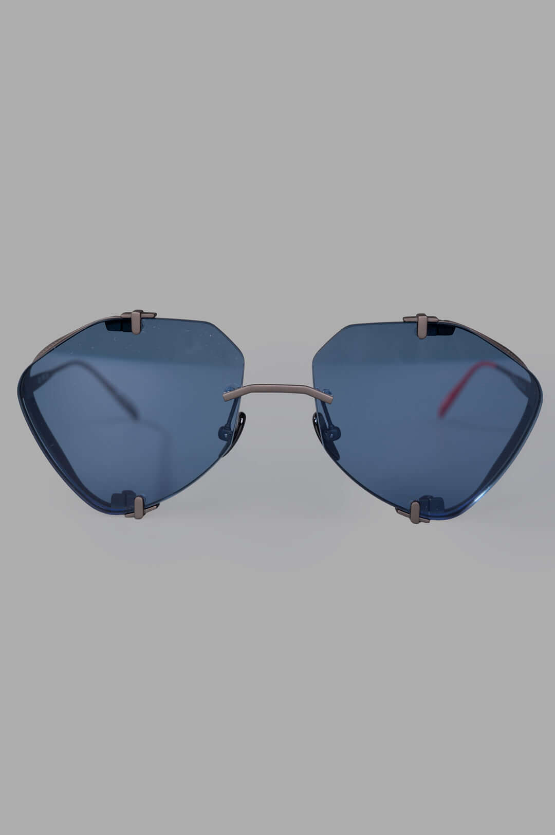 Vysen Eyewear The Khoid - KH5 rimless titanium aviator sunglasses with blue lenses, front view, showcasing modern design.