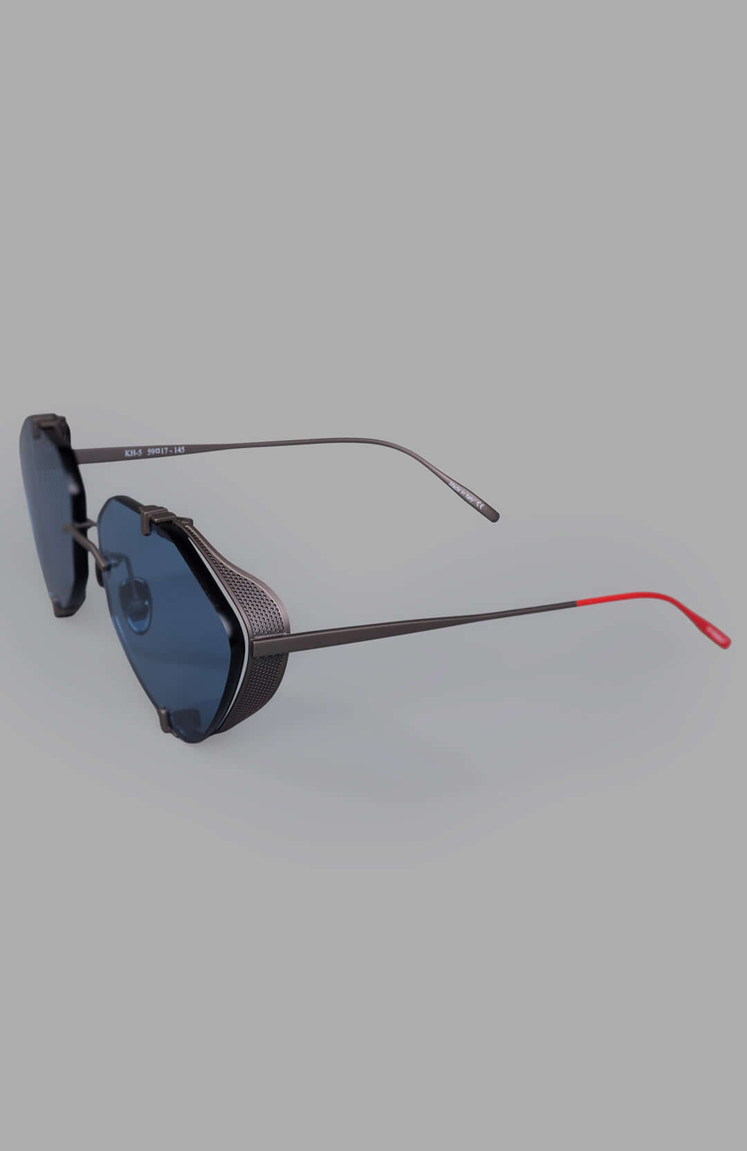 Vysen Eyewear The Khoid - KH5 rimless titanium aviator sunglasses showcasing a sleek side view with blue lenses and red.