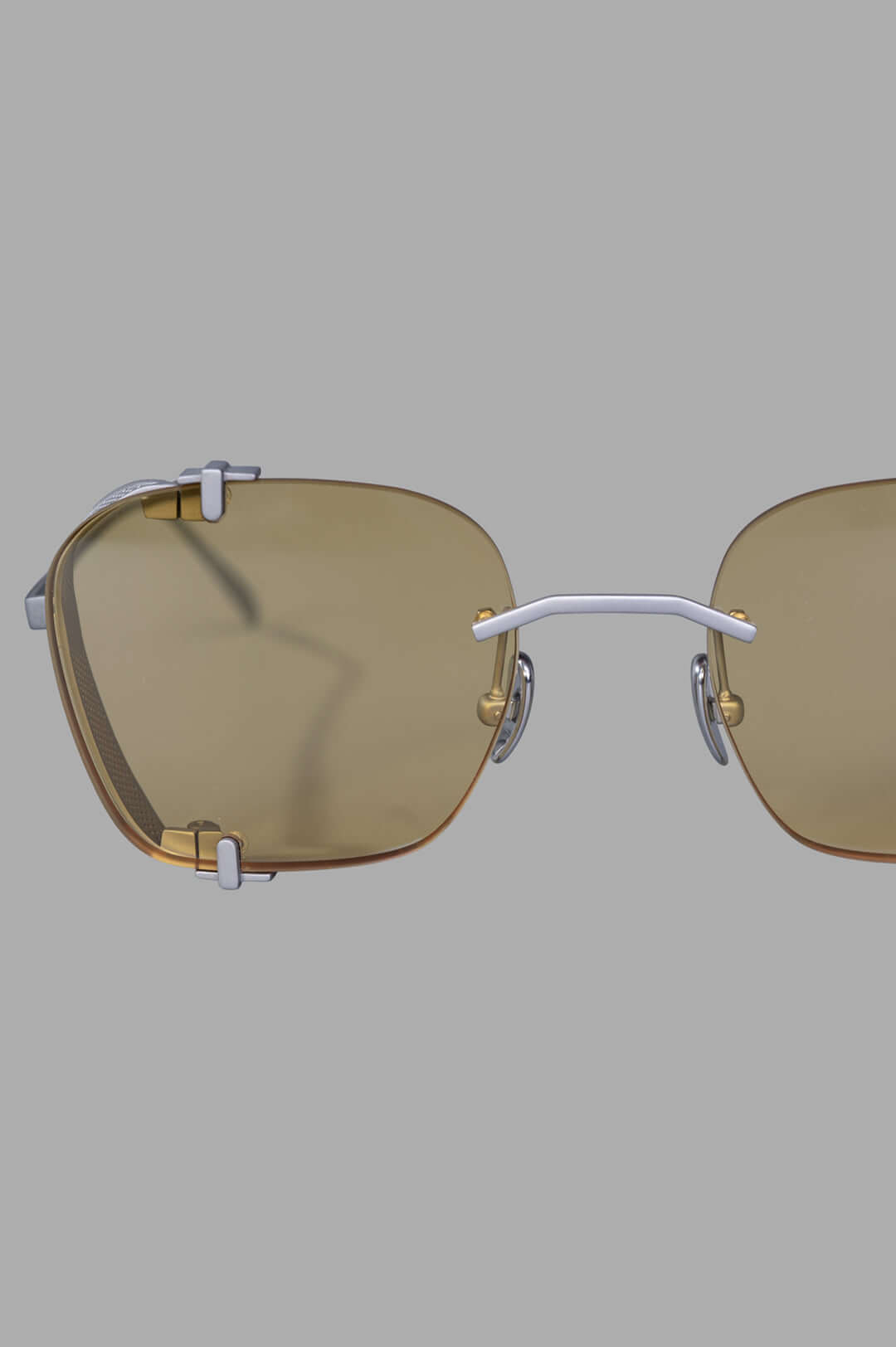 Vysen Eyewear The Bei - BE3 showcases rimless titanium sunglasses with clear yellow lenses, highlighting a bold clubmaster.