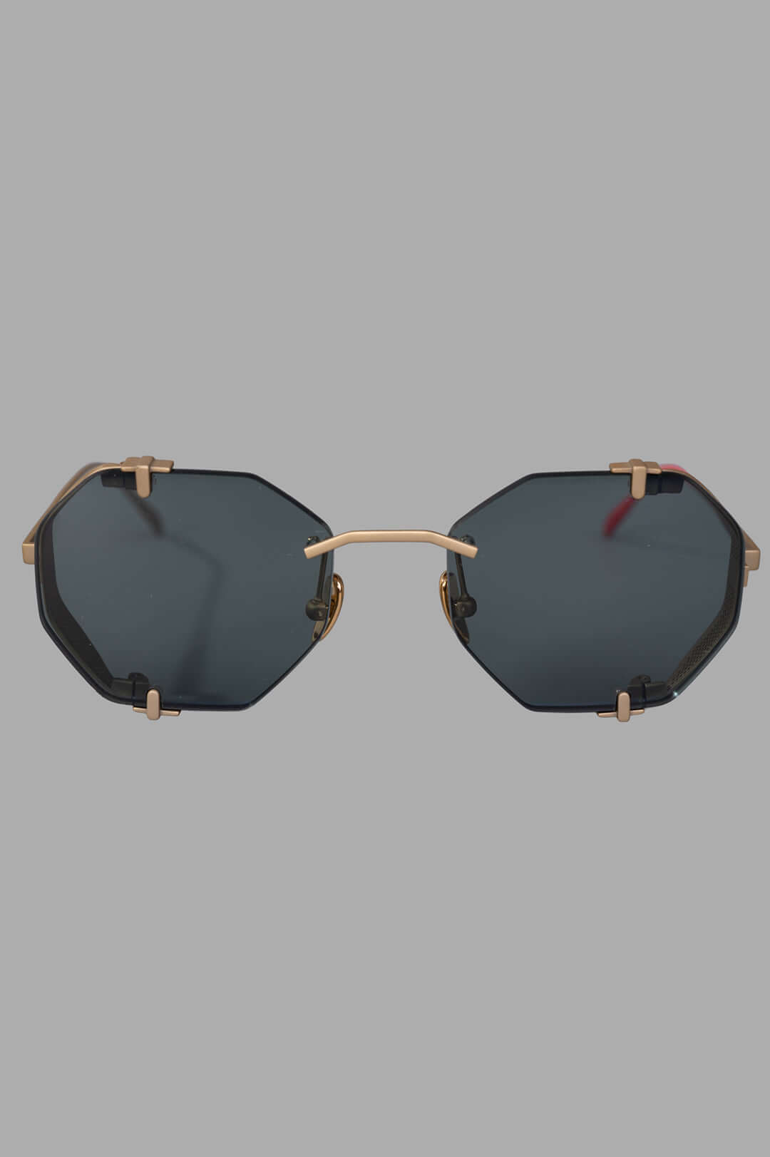 Vysen Eyewear The Sever - SV2 front view, rimless octagonal gold matte titanium frame with green lenses.