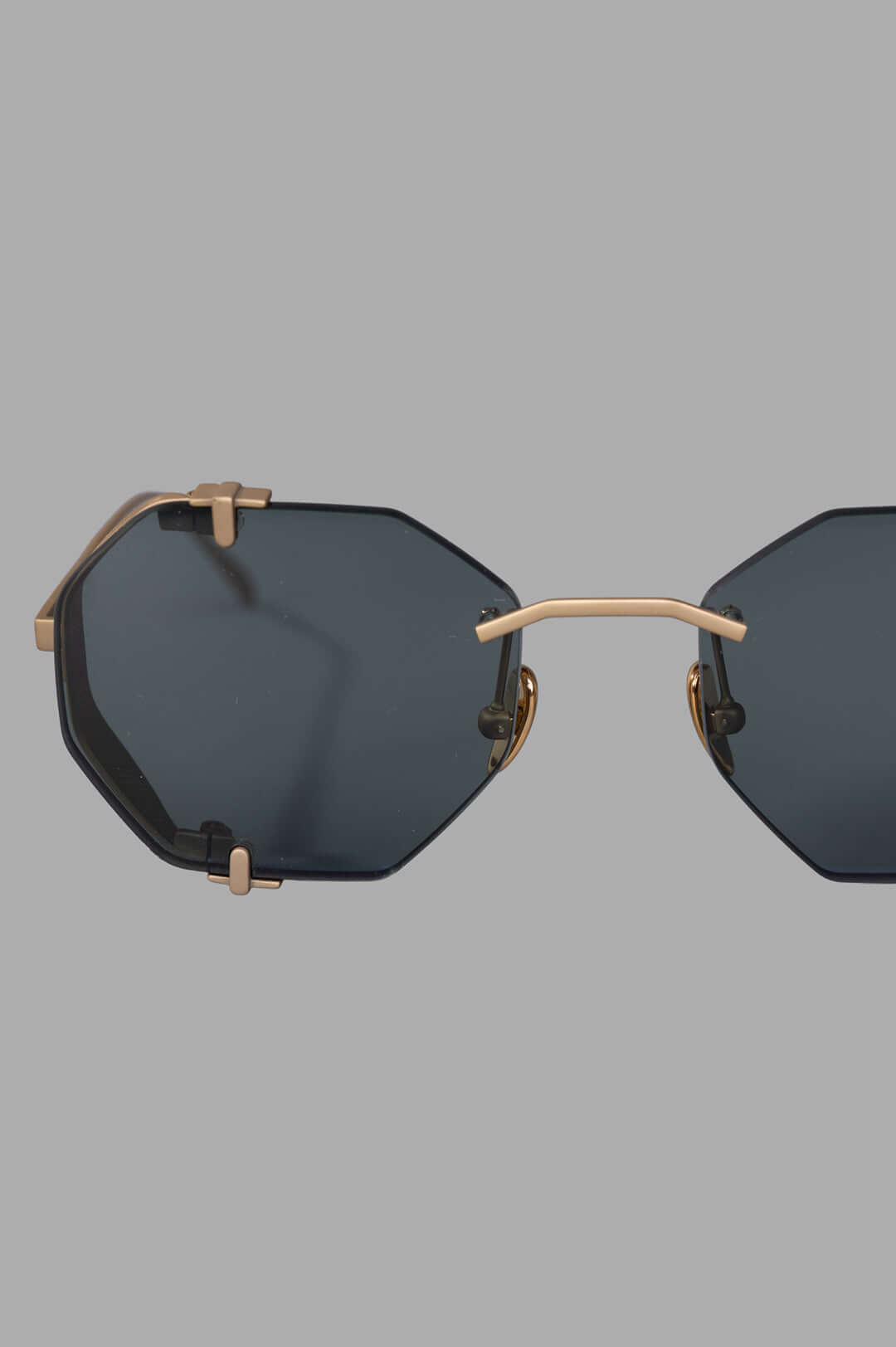 Vysen Eyewear The Sever - SV2 features a gold matte titanium rimless octagonal frame with dark green lenses and intricate.