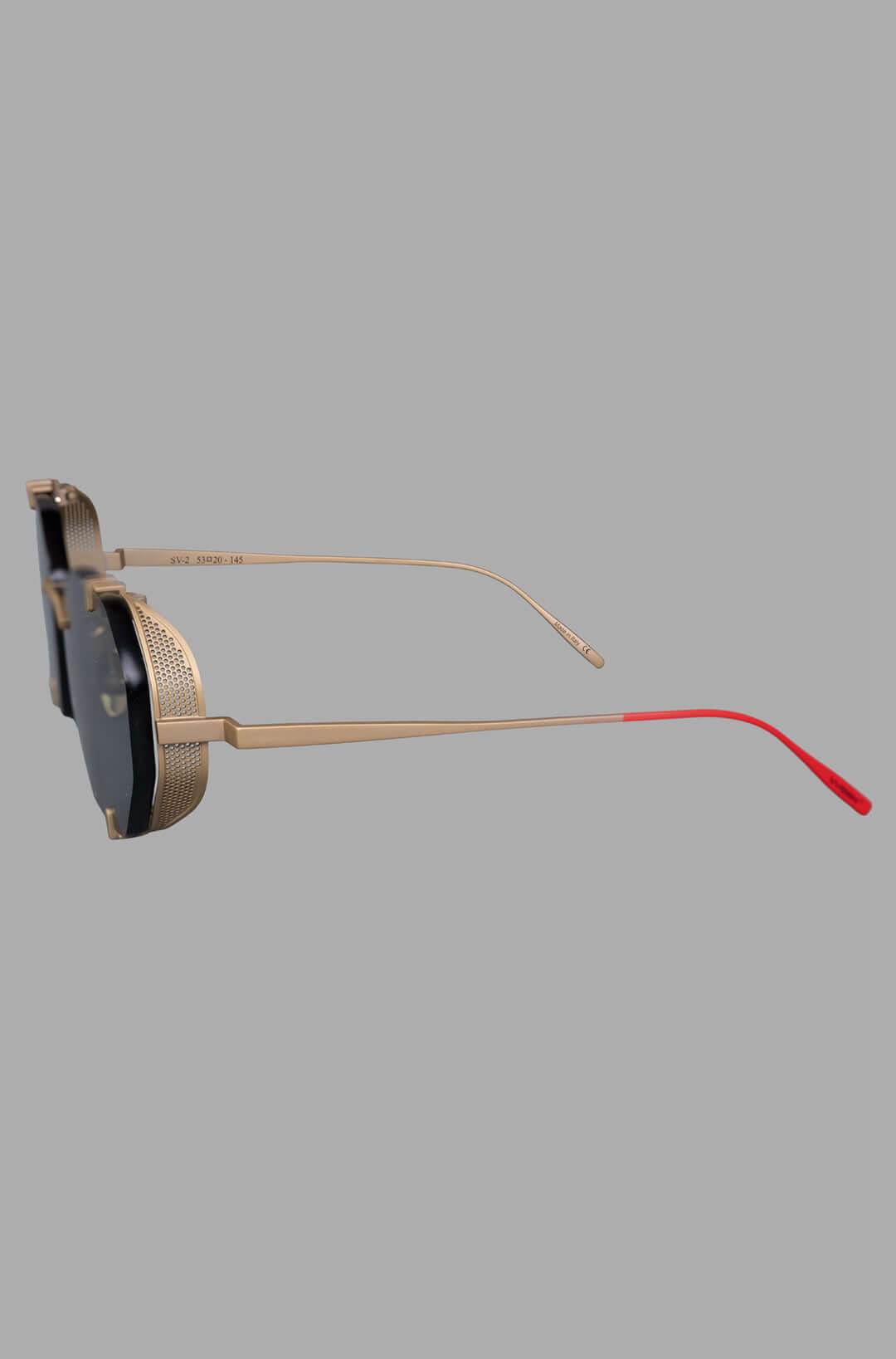 Vysen Eyewear. The Sever - SV2 side view showcases gold matte titanium frame and red temple tips with intricate detailing.