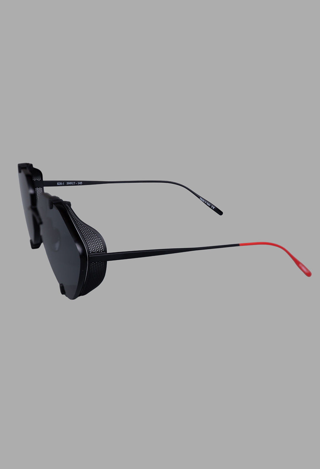 Vysen Eyewear The Khoid - KH1 showcases sleek black matte titanium sunglasses with intricate side shields, viewed from the.