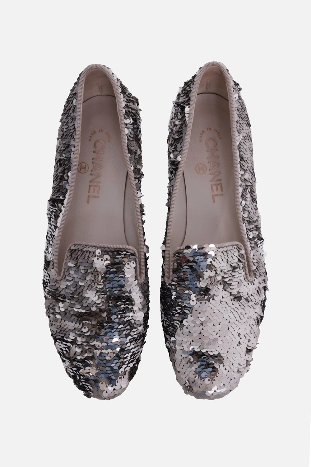 Chanel women's loafers in silver, front view, CC vamp logo and pale grosgrain trim