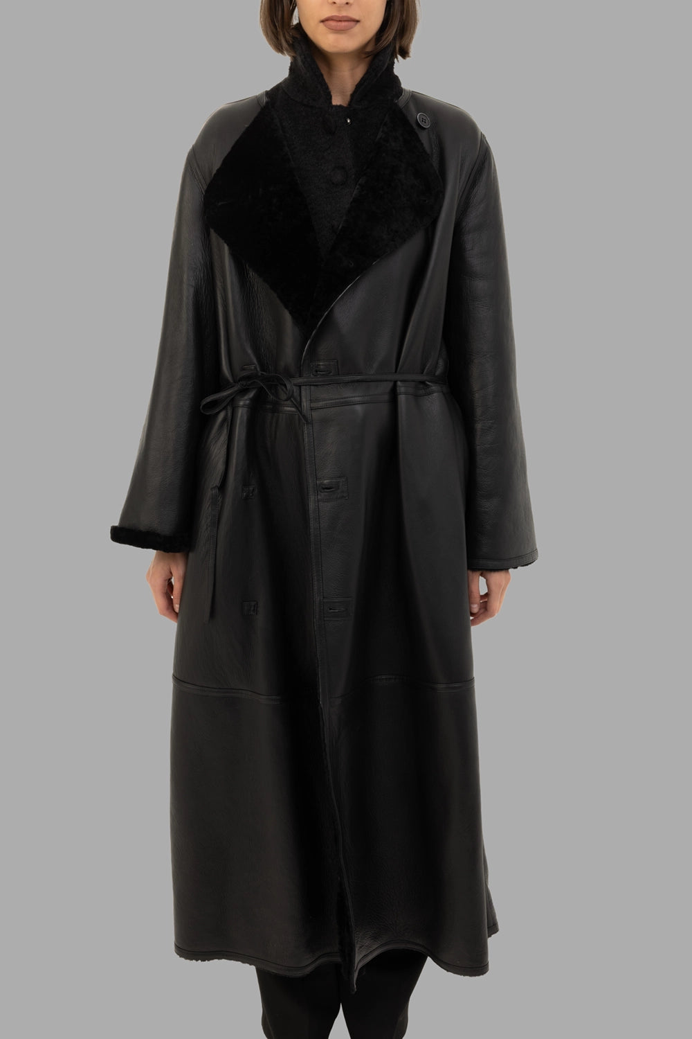By Malene Birger women's reversible shearling coat in black, front view, leather side out with tie belt