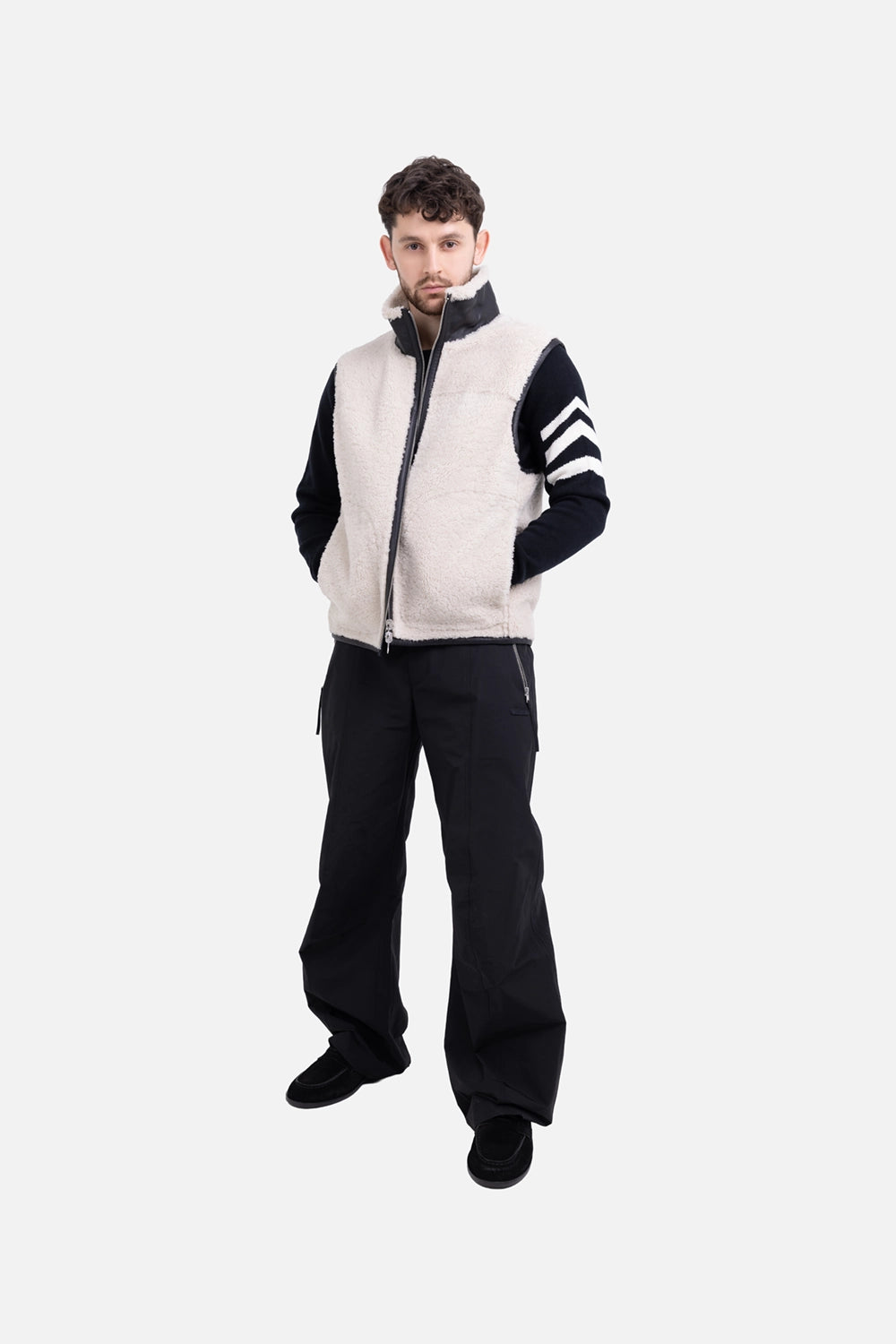 Helmut Lang men's shearling vest in cremello/black, on-model full length, cream shearling face with funnel neck