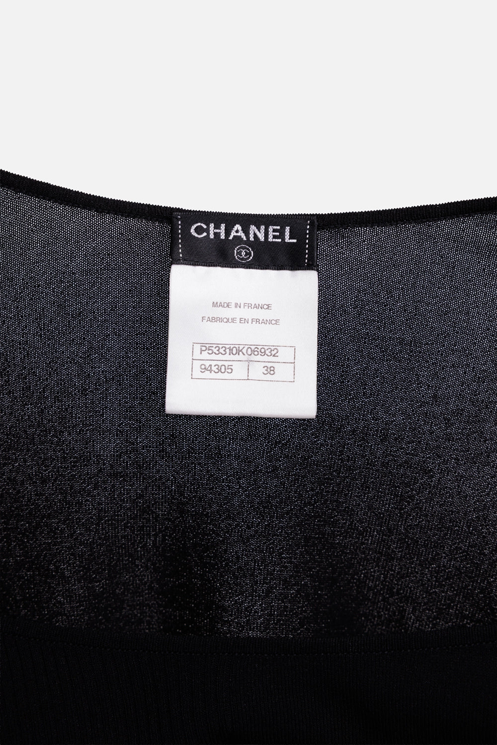 Chanel women's sheer knit top in black, label detail, Made in France tag and fine sheer knit