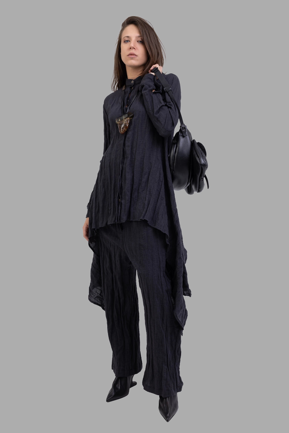 Marc Point women's black shirt, on-model full length, asymmetric draped sides and stand collar.