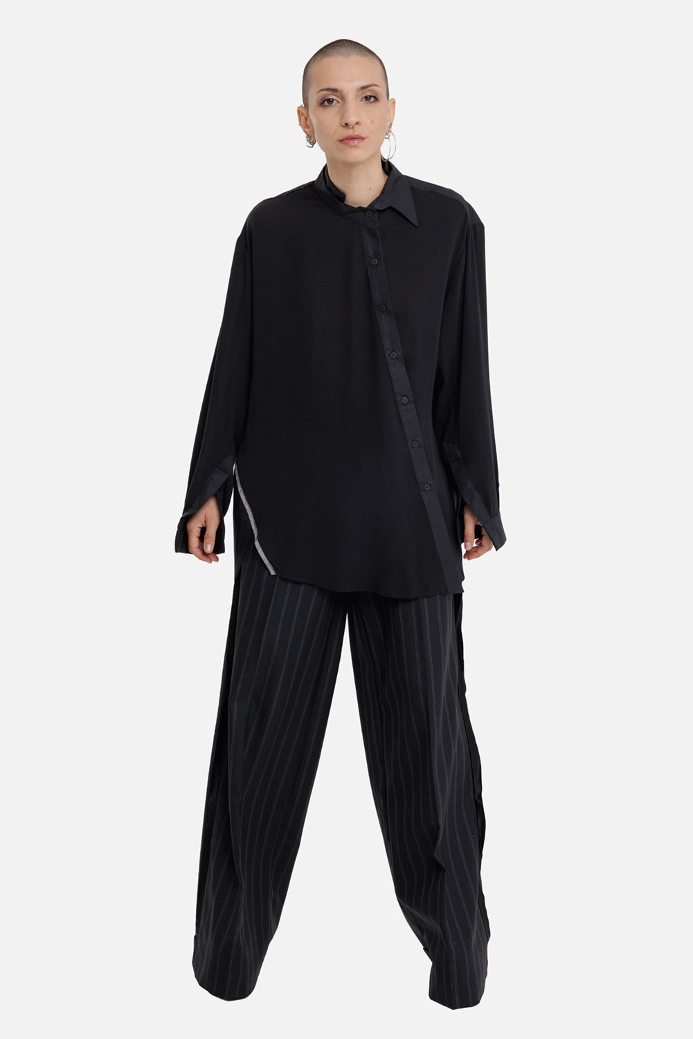 Giovanni Cavagna women's black shirt, full-length on-model view with oversized fit and asymmetric button front