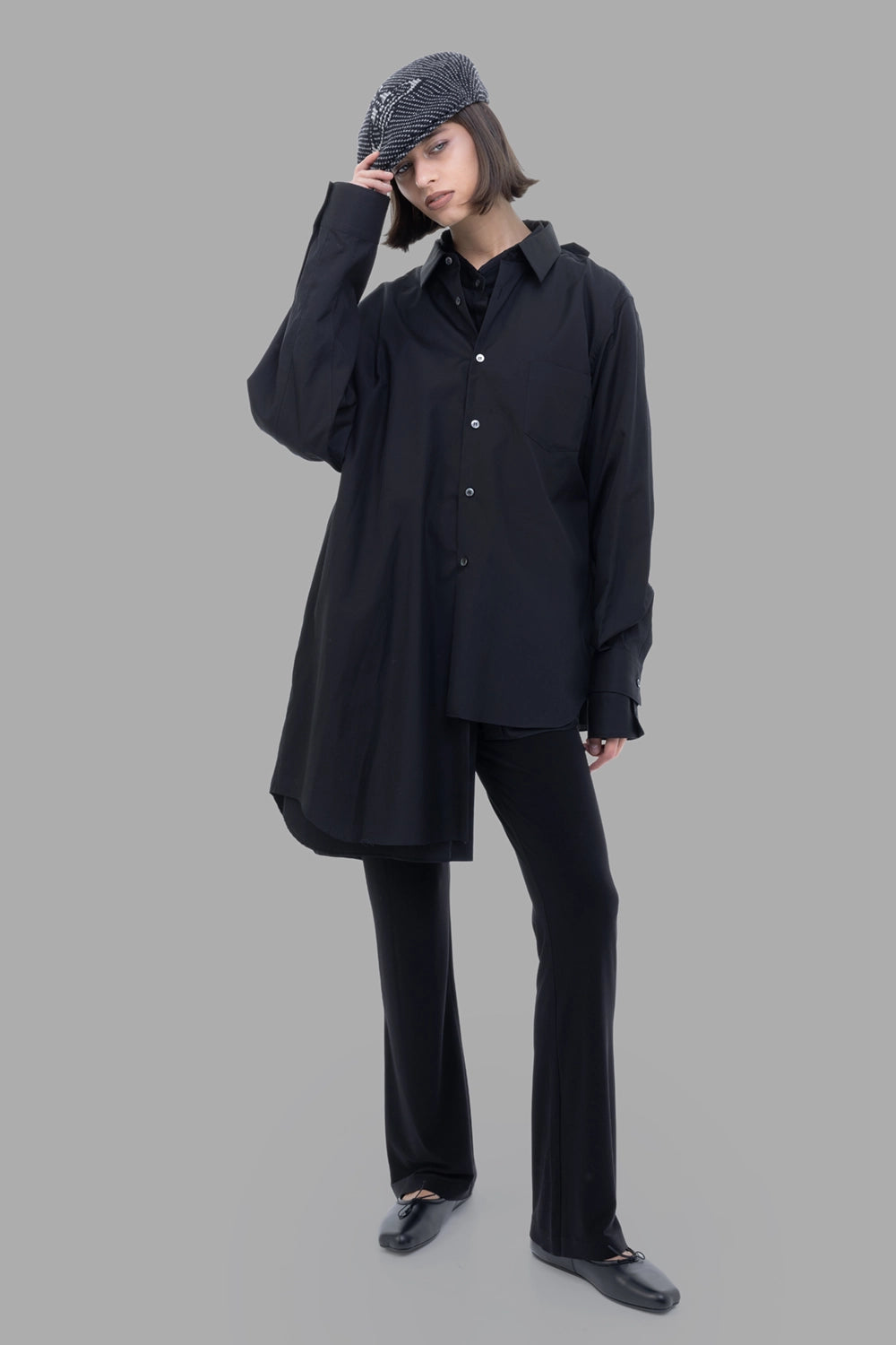 Comme des Garçons women black double-layer shirt, on-model full length, oversized cut and curved hem.