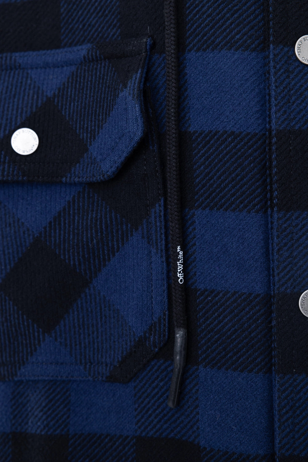 Pre-owned Off-White men's shirt jacket in blue/black check, drawstring detail view, branded cord with snap hardware