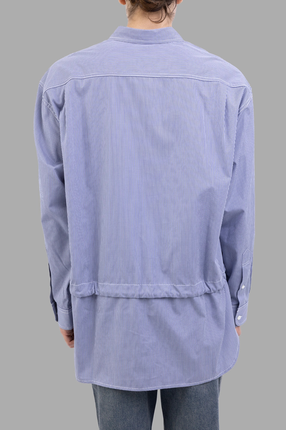 Comme des Garçons shirt in blue micro-stripe, back view, layered hem visible