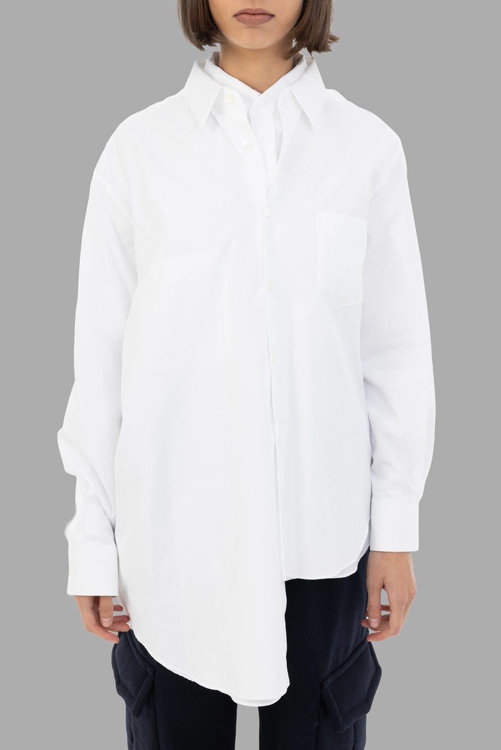 Comme des Garçons women's shirt in white, front view, chest pocket and layered hem