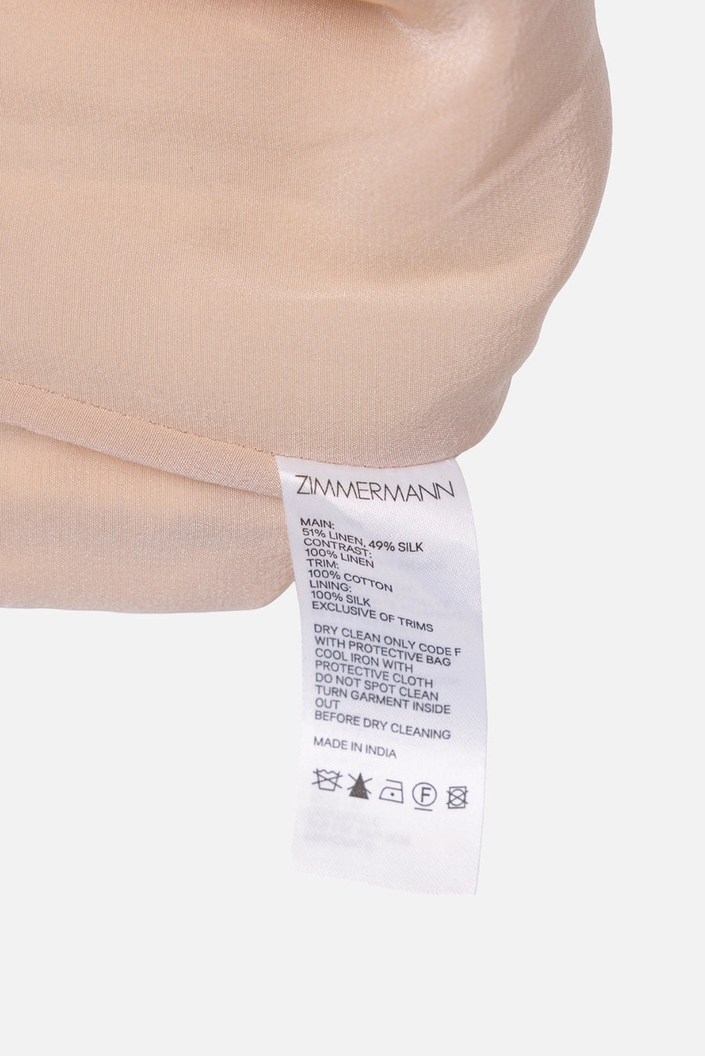 Pre-owned Zimmermann women's high-waist shorts in ivory, care label close-up, linen-silk main and silk lining