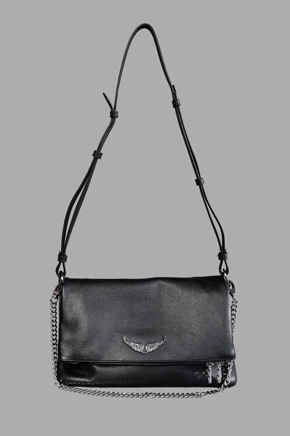 Zadig & Voltaire shoulder bag in black, front view, grained leather, crystal wings logo, chain detail, adjustable leather strap