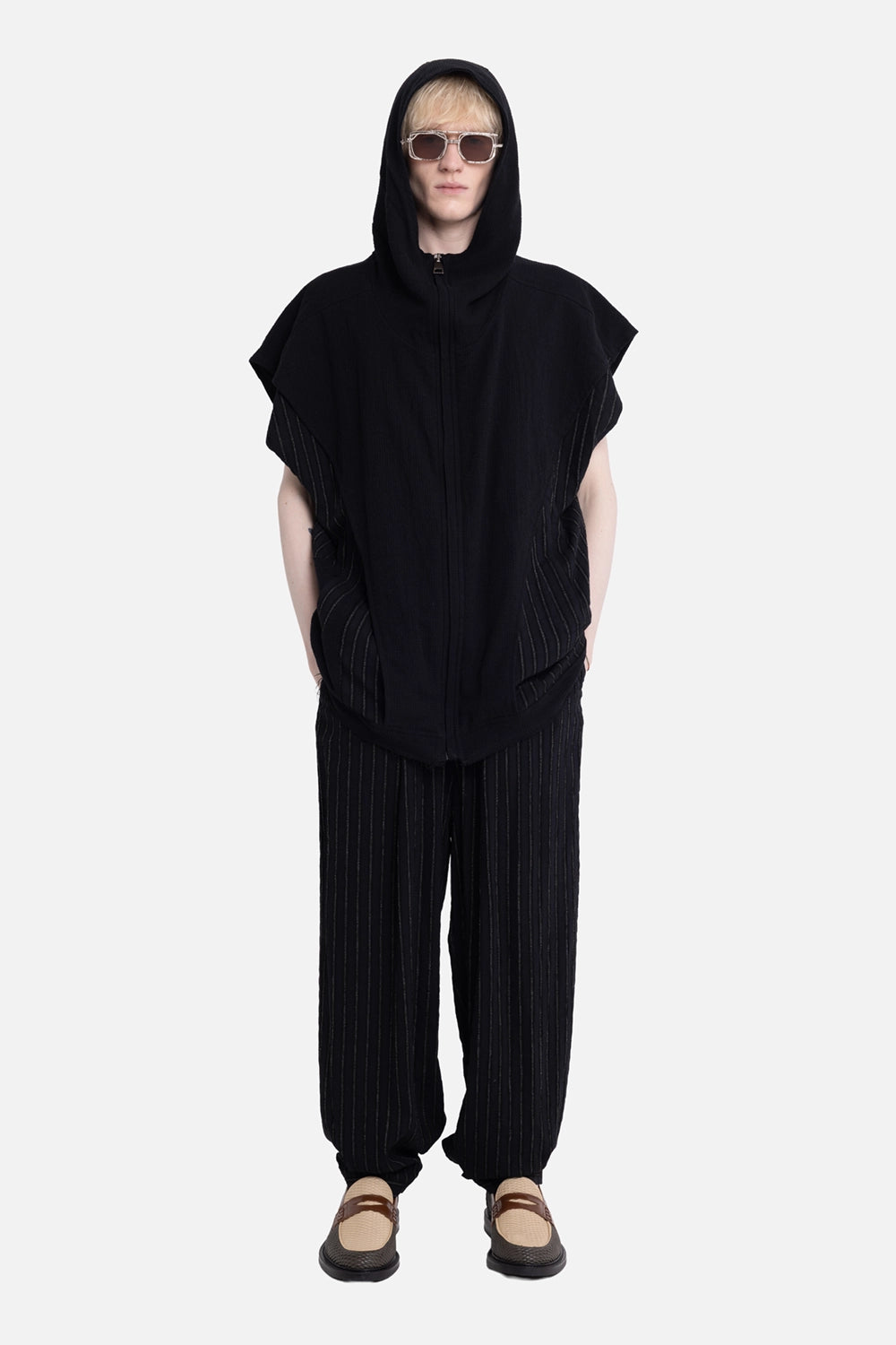 La Haine Inside Us men's sleeveless hooded jacket in black, on-model full-length, zip hood and pinstripe panels