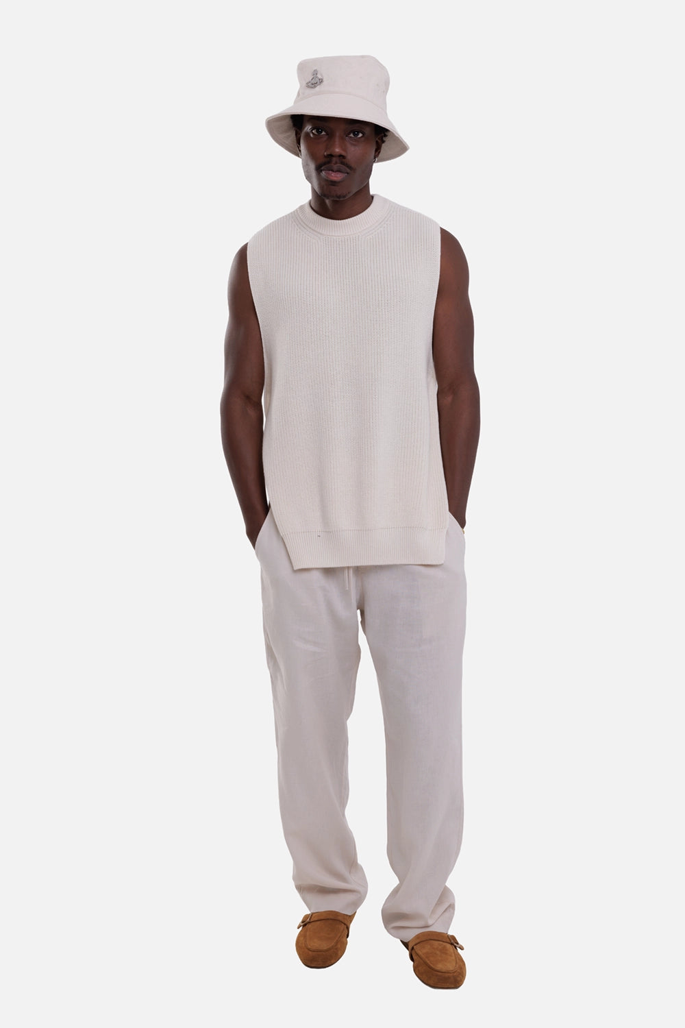 Gentryportofino men's knit vest in latte, on-model full-length view, sleeveless cut and ribbed crewneck