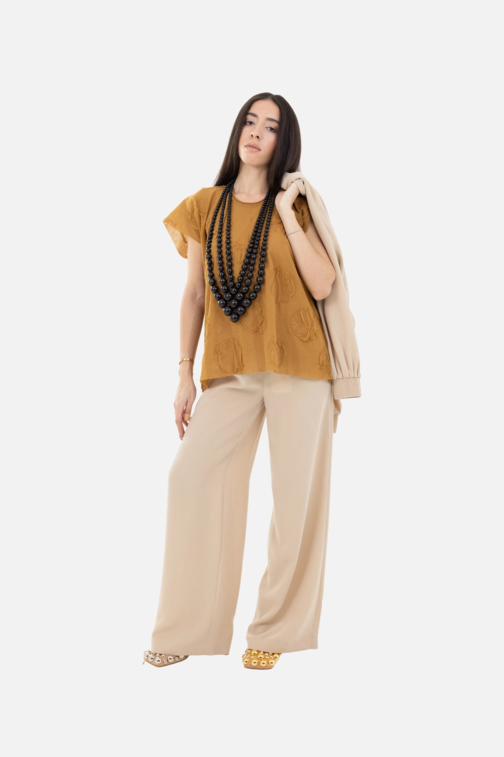 Uma Wang women’s sleeveless top in mustard, on-model full-length, semi-sheer textured pois top styled with wide trousers
