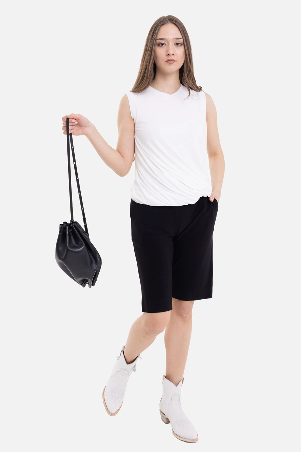 Norma Kamali women's Sleeveless Twist Top in snow white, on-model full length with sleeveless cut and side ruching