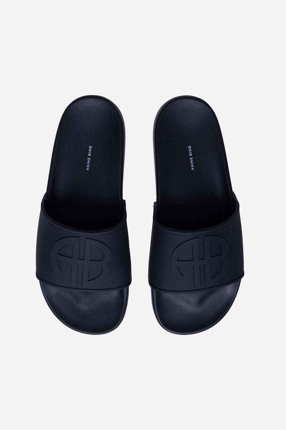 ANINE BING women's slides in Marine Blue, front view, embossed AB monogram strap