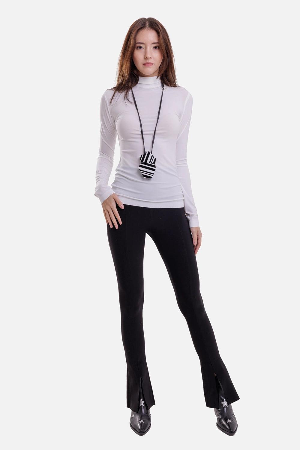 Norma Kamali women's Snow White turtleneck top, on-model full-length view with slim fit and extended sleeves