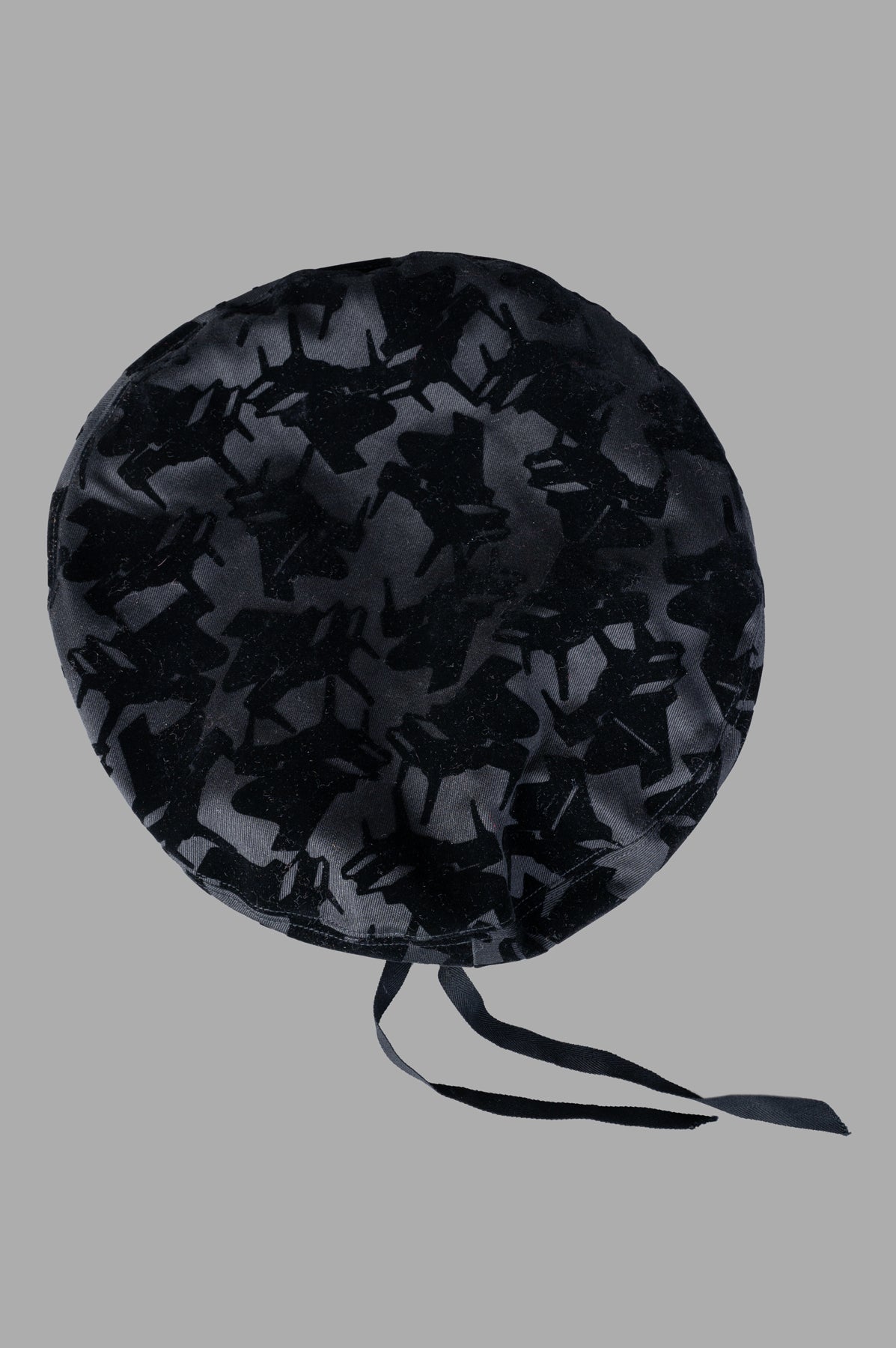 Kijima Takayuki Beret Hat, front view with black pattern detail and ribbon ties, displayed on a gray background.