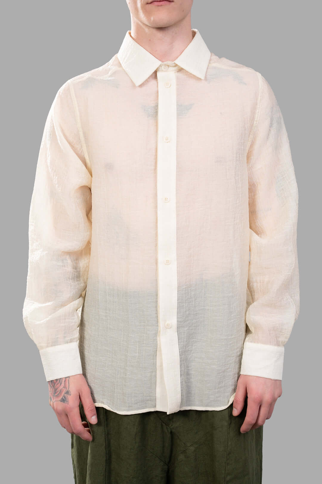 Justin Gall Crinkled Shirt in ecru, featuring semi-transparent texture, relaxed fit, and unique crinkled design on model.