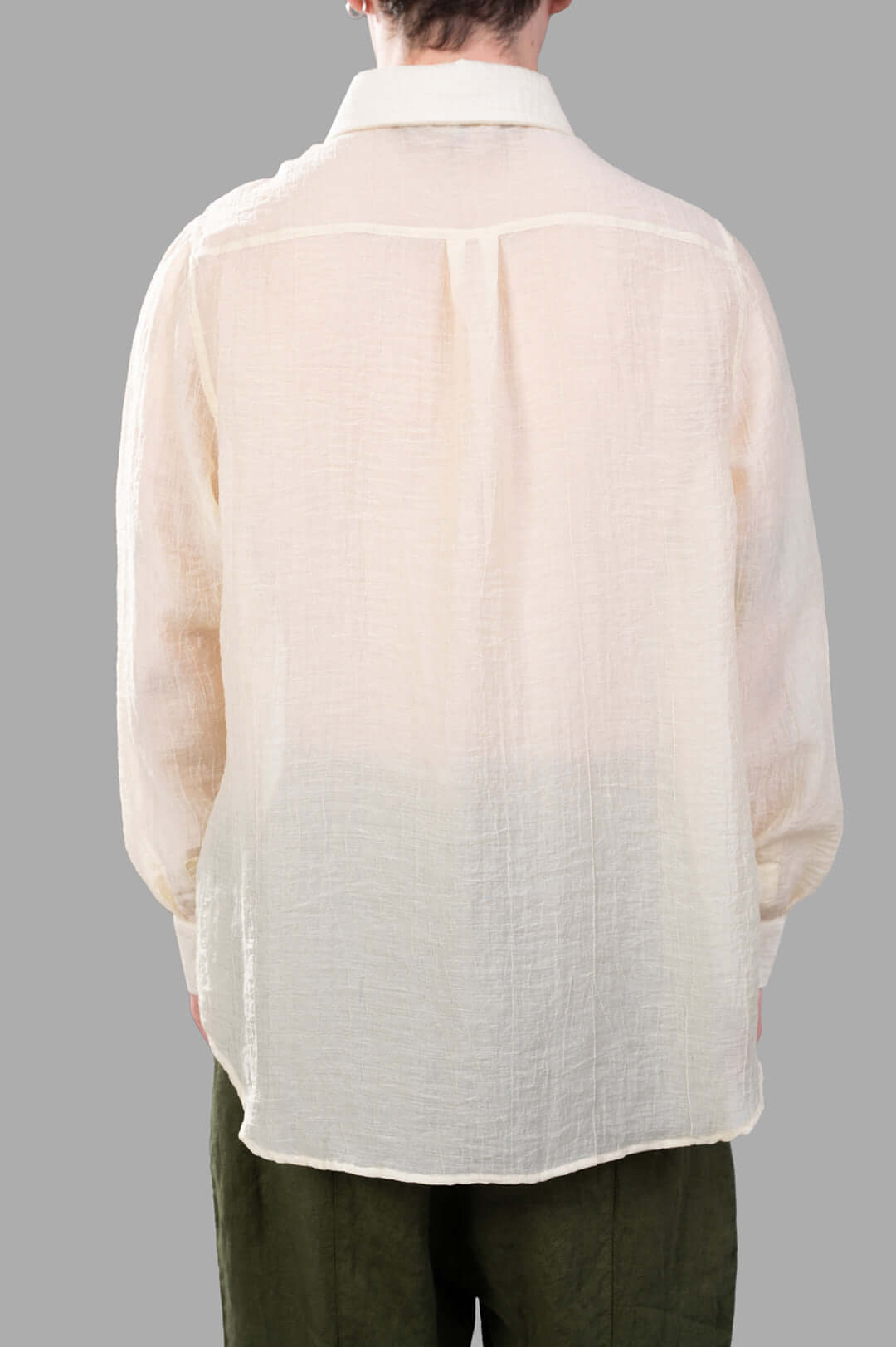 Justin Gall Crinkled Shirt in ecru, displaying relaxed-fit back texture and unique semi-transparent detailing.